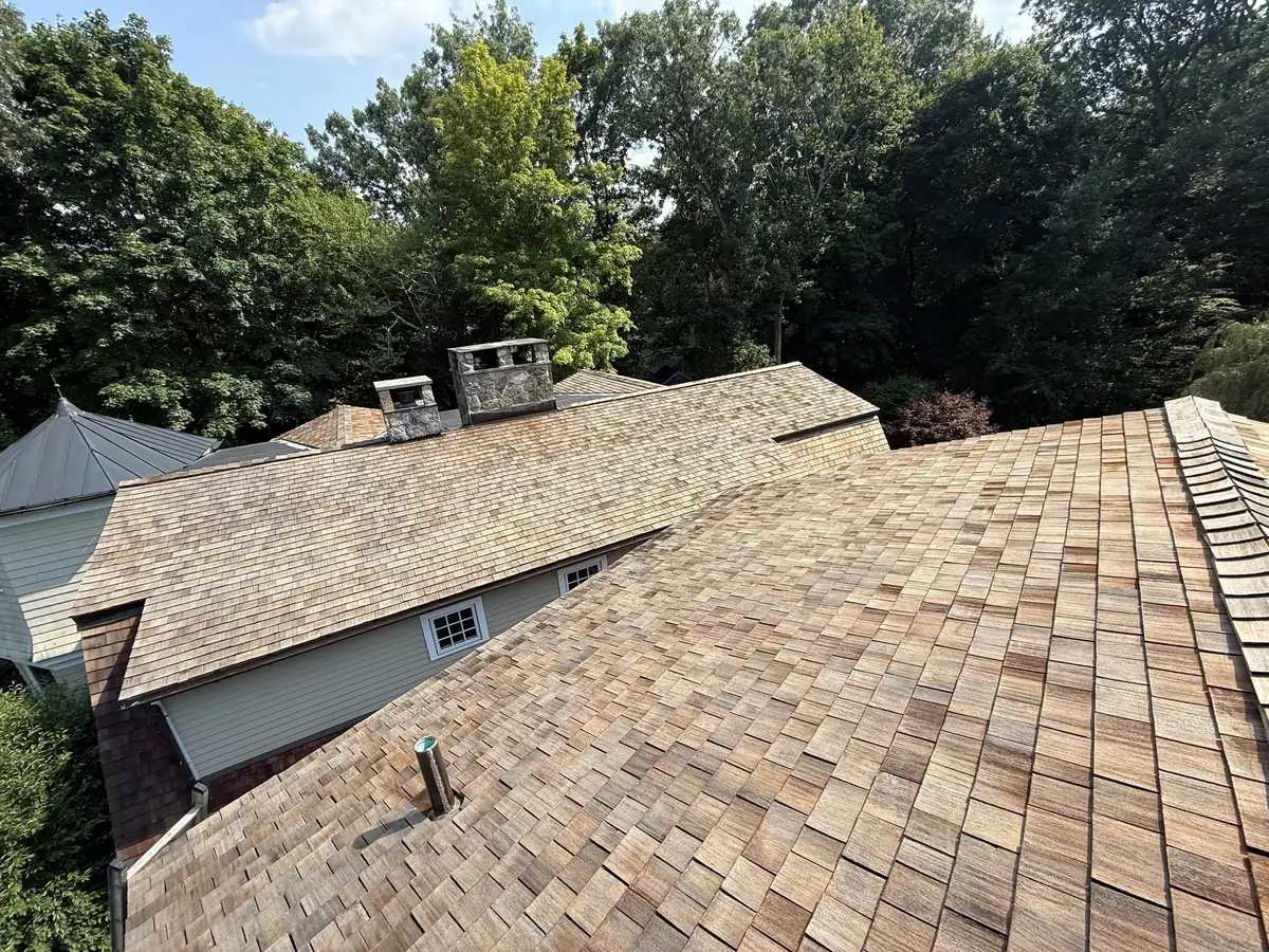 Cedar shake roof during the cleaning process