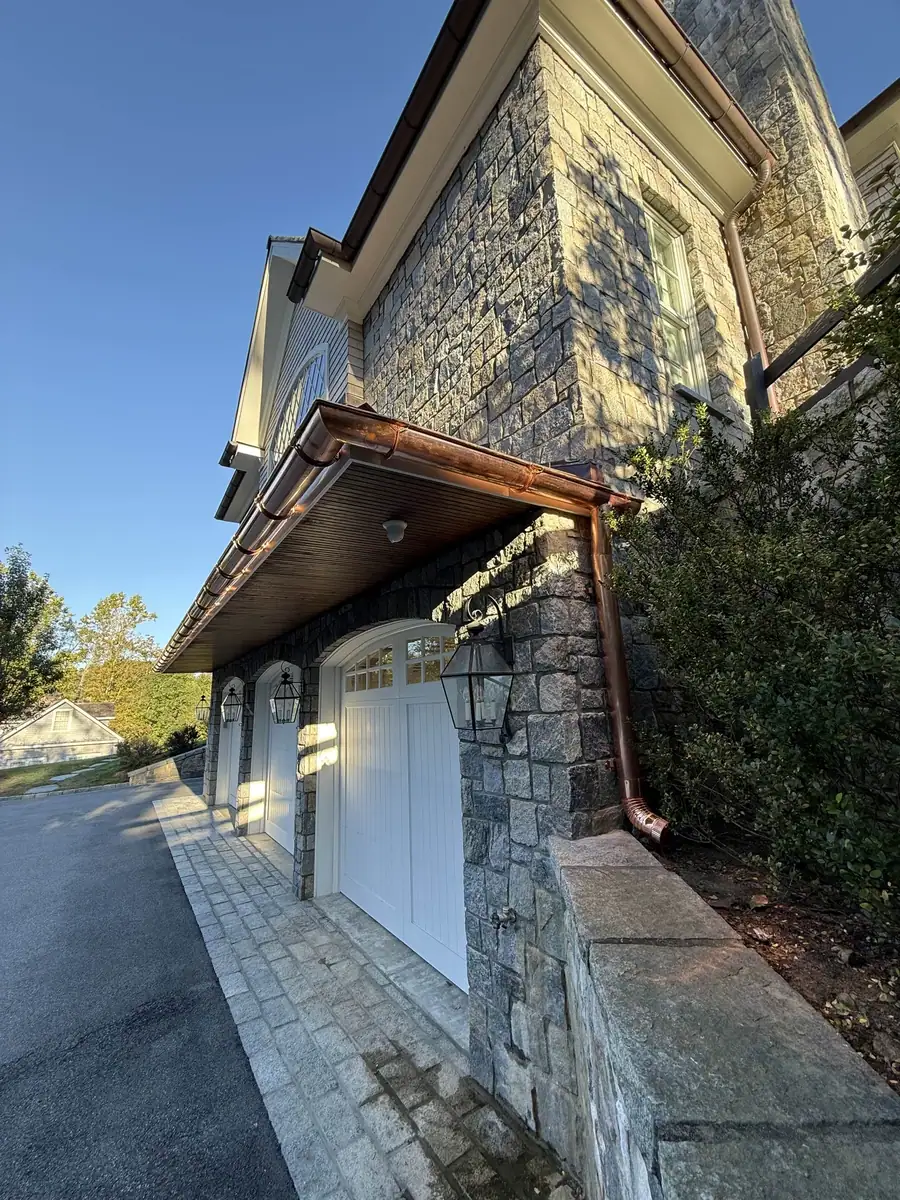 Polished copper gutter detail at the Greenwich home