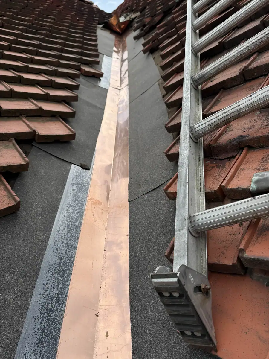 New roof underlayment and copper valley flashing in progress