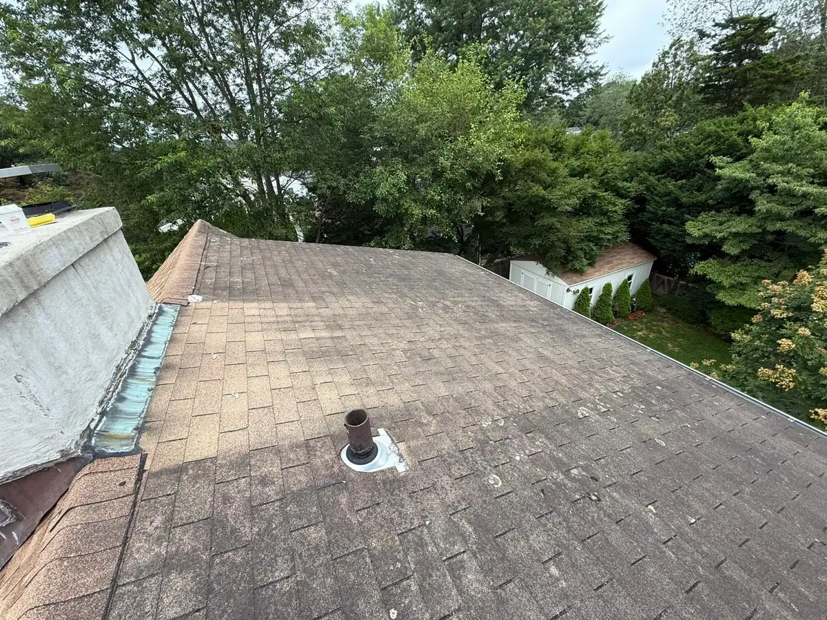 Existing worn shingle roof before replacement in Stamford
